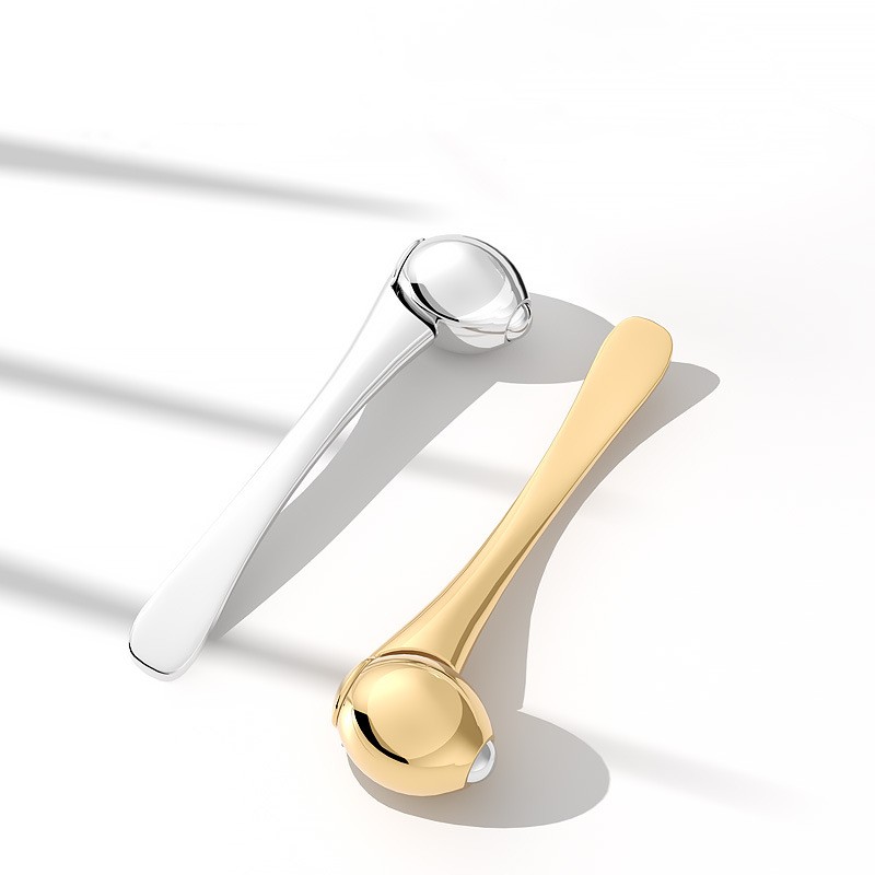 Eye Roller Hierontapuikko Silmänympärysvoide Applikaattori Kosmeettiset lastat Ryppyjä estävä kasvojen lusikka kultaseos kasvojenhoitotyökalu