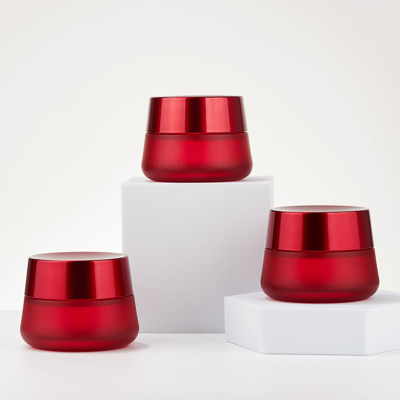 Pyöreä kosmeettinen punainen kermapurkki Tyhjä lasivoidepurkki