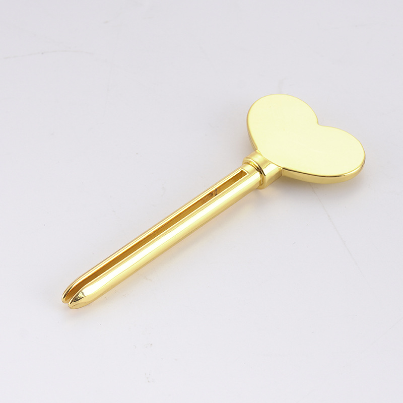 Metallinen hammastahna-annostelija kasvojen puhdistusaine hammastahnaputkipuristin Avaimen muoto Kosmetiikka Tube Puristin Metallinen hammastahna-annostelija kasvojen puhdistusaine hammastahnaputkipuristin Avaimen muoto Kosmetiikka Tube Puristin