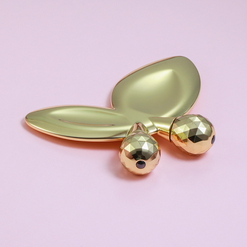 Sinkkiseoksesta valmistettu perhosen muotoinen kasvohierontarulla Sinkkiseoksesta valmistettu perhosen muotoinen kasvohierontarulla