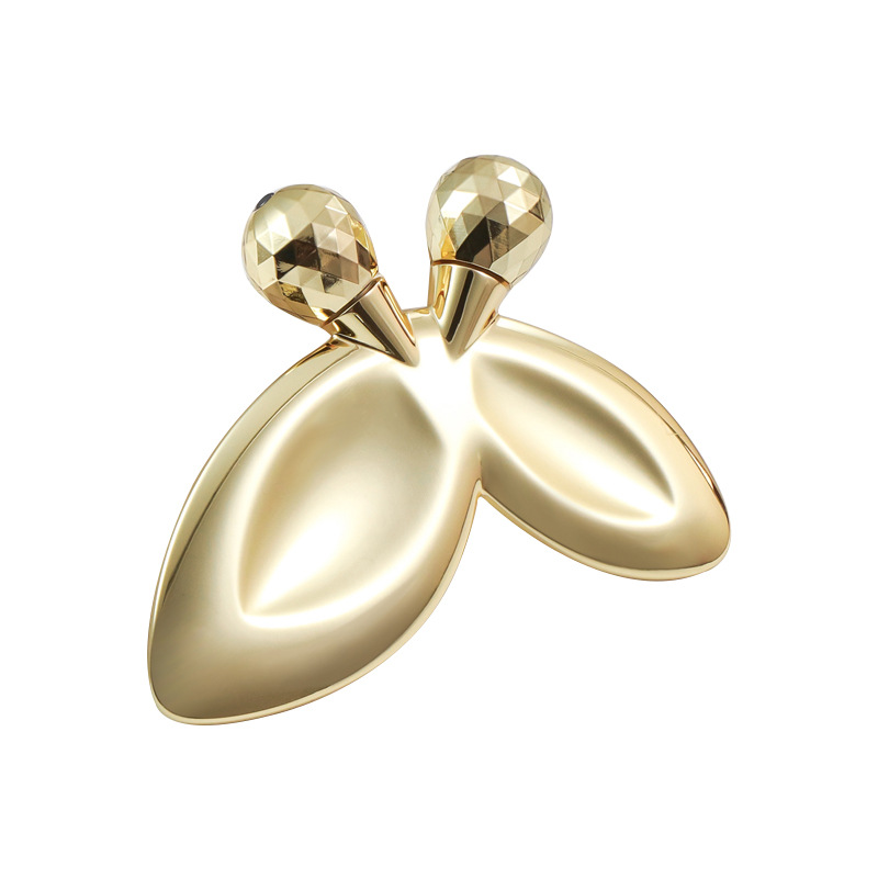 Sinkkiseoksesta valmistettu perhosen muotoinen kasvohierontarulla Sinkkiseoksesta valmistettu perhosen muotoinen kasvohierontarulla