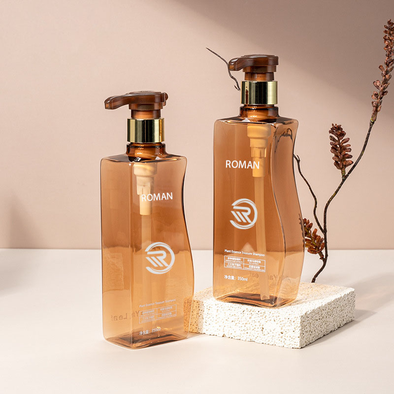 Luotettava 350 ml:n 500 ml:n kaarevan muotoinen meripihkanvärinen lemmikkieläinten muovinen tyhjä vartaloemulsiopullo pumpulla hiustenhoitoshampoohoitoon tai kasvovoiteeseen